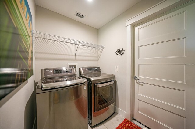 171 Mark Twain Ln, Rotonda West, FL 33947 - laundry area featuring washer and dryer