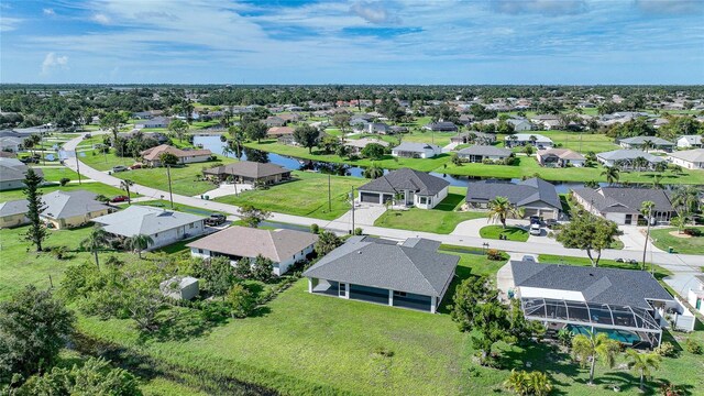 171 Mark Twain Ln, Rotonda West, FL 33947 - aerial view of residential area with a nearby body of water