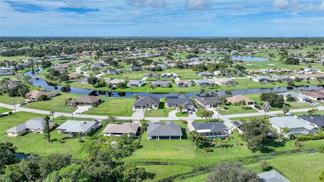 171 Mark Twain Ln, Rotonda West, FL 33947 - aerial overview of property's location with a nearby body of water and nearby suburban area
