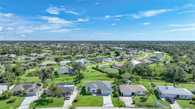 171 Mark Twain Ln, Rotonda West, FL 33947 - aerial perspective of suburban area