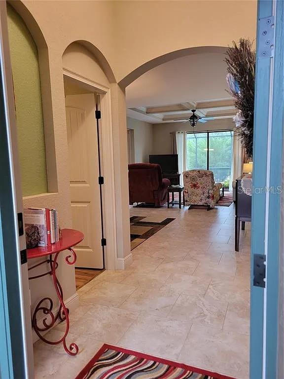 142 Yellow Pine Dr, Rotonda West, FL 33947 - hall with arched walkways