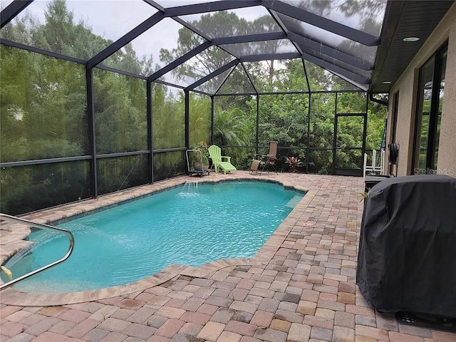 142 Yellow Pine Dr, Rotonda West, FL 33947 - swimming pool with a patio area, a grill, and a lanai