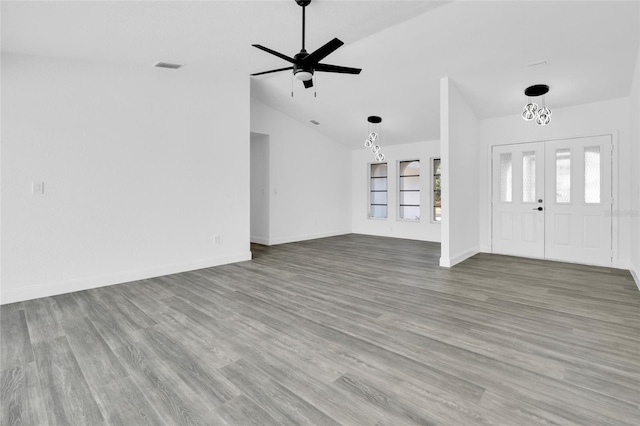 4210 Day St, Port Charlotte, FL 33948 - unfurnished living room featuring vaulted ceiling, wood finished floors, baseboards, and ceiling fan