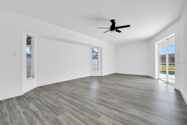 4210 Day St, Port Charlotte, FL 33948 - unfurnished room featuring ceiling fan, dark wood-style floors, and baseboards