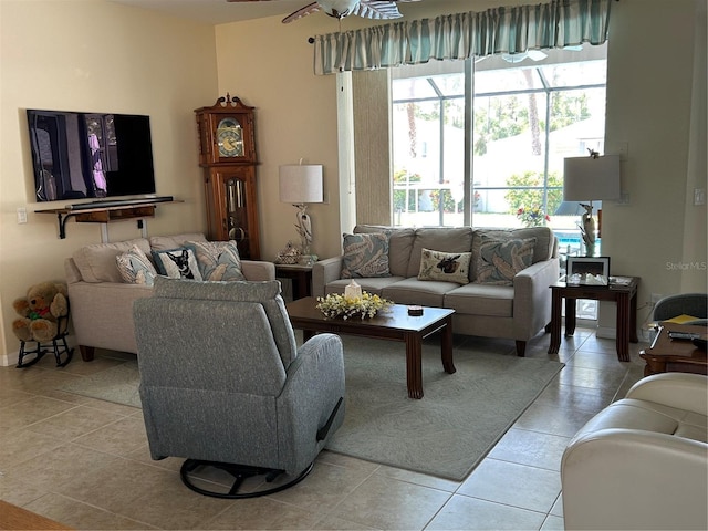 living room with light tile patterned floors and ceiling fan