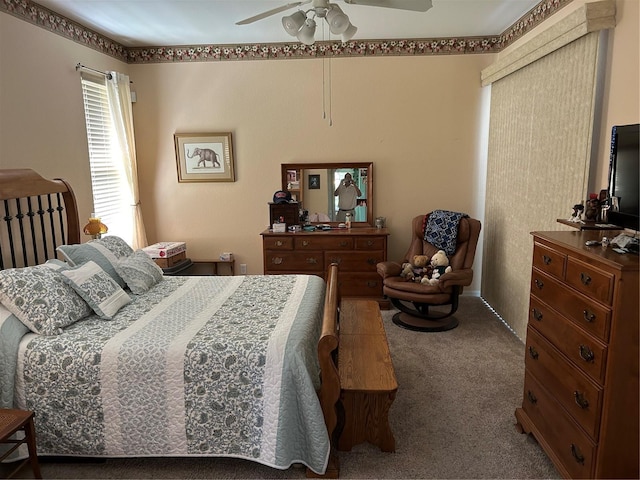 carpeted bedroom featuring ceiling fan
