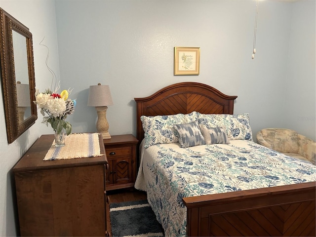 bedroom with wood finished floors