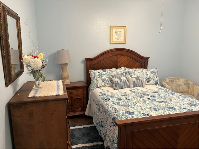 bedroom featuring wood finished floors