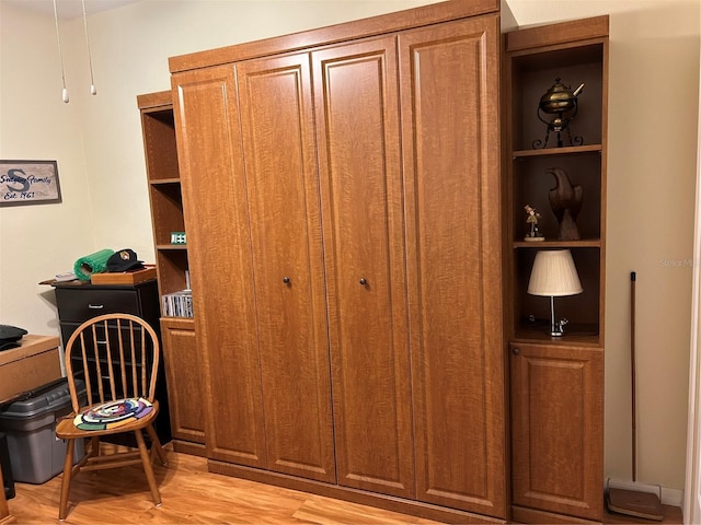 office with light wood-style flooring