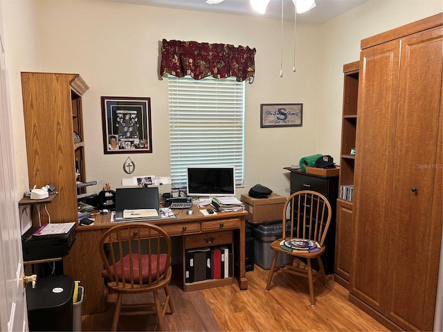 office space with wood finished floors and a ceiling fan