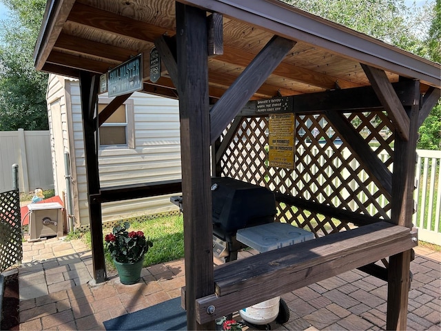 wooden deck featuring a patio and fence