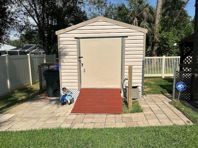 view of shed featuring a fenced backyard