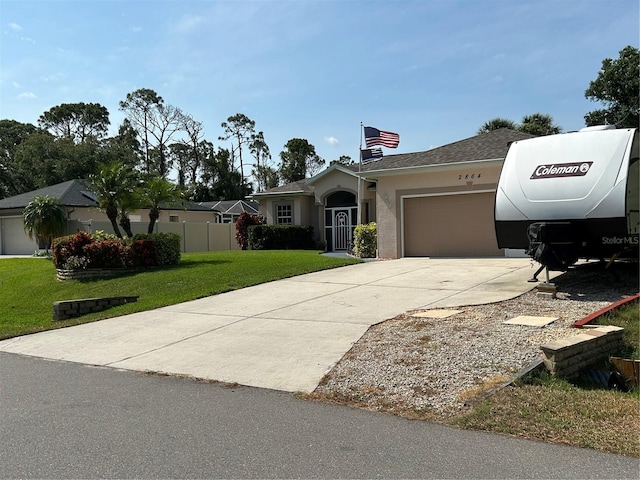 ranch-style home with a garage, driveway, stucco siding, and a shingled roof