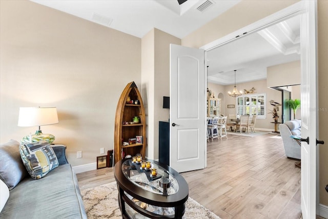 15044 San Domingo Blvd, Port Charlotte, FL 33981 - living room with light wood-type flooring, a chandelier, and baseboards