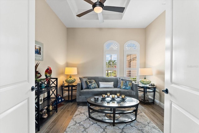 15044 San Domingo Blvd, Port Charlotte, FL 33981 - living room featuring a ceiling fan, wood finished floors, baseboards, and a raised ceiling