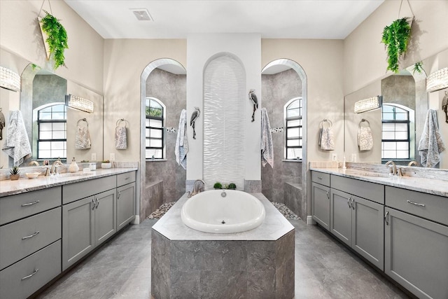 15044 San Domingo Blvd, Port Charlotte, FL 33981 - bathroom featuring plenty of natural light, a bath, and two vanities