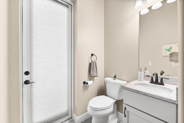 15044 San Domingo Blvd, Port Charlotte, FL 33981 - bathroom featuring vanity, toilet, and baseboards