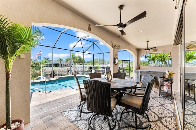 15044 San Domingo Blvd, Port Charlotte, FL 33981 - view of patio / terrace featuring an outdoor pool, ceiling fan, a lanai, boat lift, and outdoor dining area