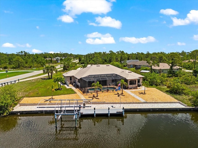 15044 San Domingo Blvd, Port Charlotte, FL 33981 - back of house with a water view, an outdoor pool, boat lift, a lanai, and a yard