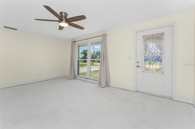 11 Oakland Hills Rd, Rotonda West, FL 33947 - entrance foyer featuring a ceiling fan, concrete flooring, and baseboards