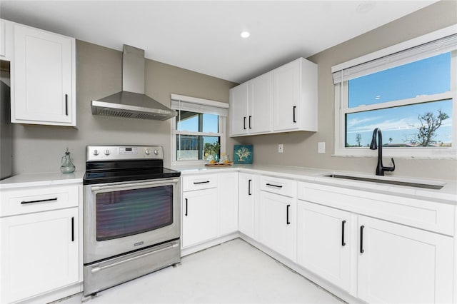 11 Oakland Hills Rd, Rotonda West, FL 33947 - kitchen featuring wall chimney exhaust hood, stainless steel range with electric stovetop, a sink, light countertops, and recessed lighting