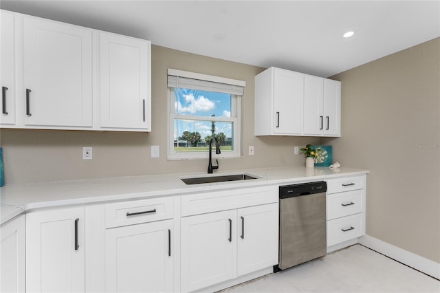 11 Oakland Hills Rd, Rotonda West, FL 33947 - kitchen featuring dishwasher, a sink, white cabinets, baseboards, and recessed lighting