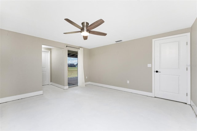 11 Oakland Hills Rd, Rotonda West, FL 33947 - empty room with a ceiling fan and baseboards