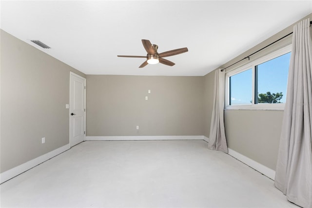 11 Oakland Hills Rd, Rotonda West, FL 33947 - empty room with a ceiling fan, concrete floors, and baseboards