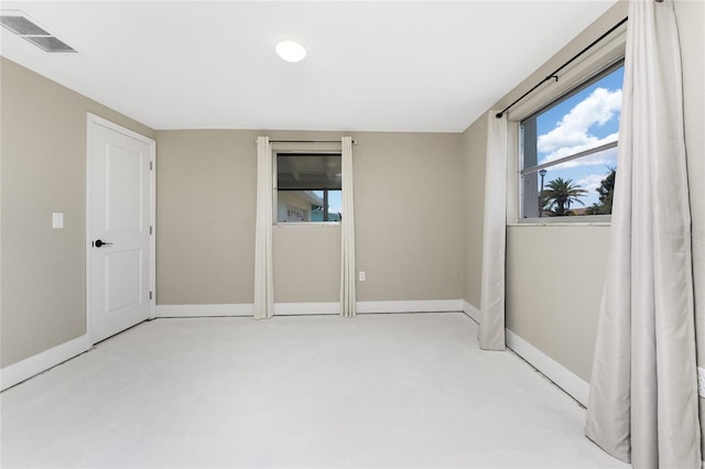 11 Oakland Hills Rd, Rotonda West, FL 33947 - unfurnished bedroom featuring multiple windows and baseboards