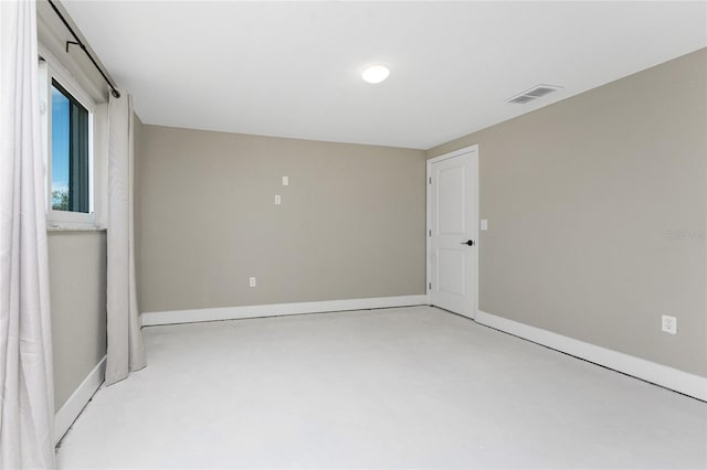 11 Oakland Hills Rd, Rotonda West, FL 33947 - spare room featuring finished concrete flooring and baseboards