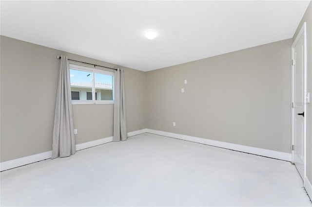 11 Oakland Hills Rd, Rotonda West, FL 33947 - spare room featuring concrete floors and baseboards