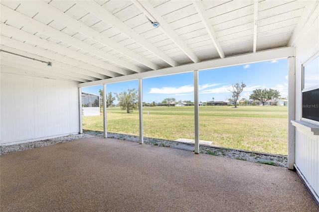11 Oakland Hills Rd, Rotonda West, FL 33947 - unfurnished sunroom featuring beamed ceiling