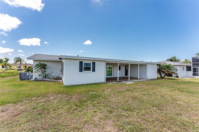 11 Oakland Hills Rd, Rotonda West, FL 33947 - view of front of property featuring a front yard and stucco siding