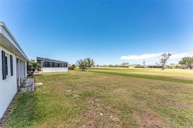 11 Oakland Hills Rd, Rotonda West, FL 33947 - view of green lawn featuring a sunroom