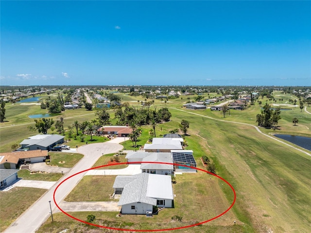 11 Oakland Hills Rd, Rotonda West, FL 33947 - aerial perspective of suburban area featuring a large body of water and a golf club