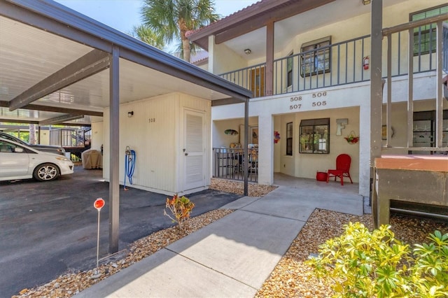 507 Pine Hollow Cir Unit 507, Englewood, FL 34223 - doorway to property with covered parking