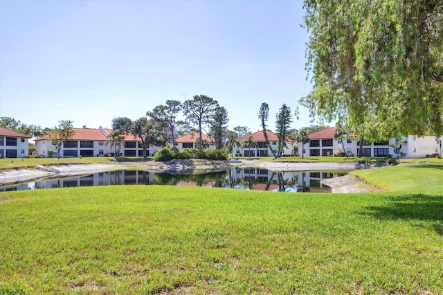 507 Pine Hollow Cir Unit 507, Englewood, FL 34223 - view of green lawn with a water view and a residential view