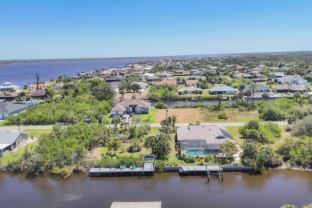 aerial view of residential area with a large body of water