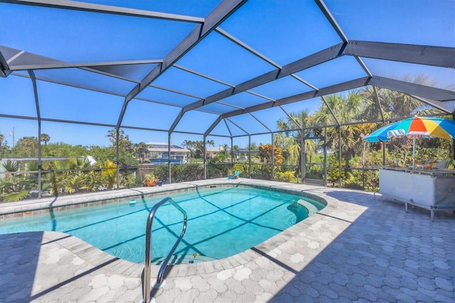 swimming pool with a patio and a lanai