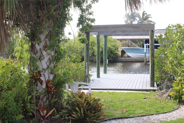 dock area with a water view and boat lift