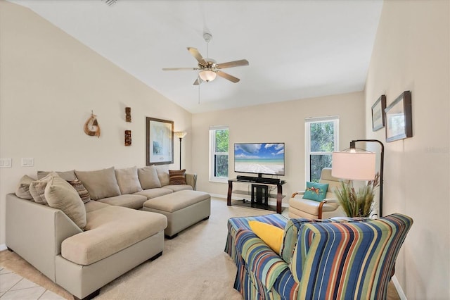 living room with vaulted ceiling, a ceiling fan, and baseboards