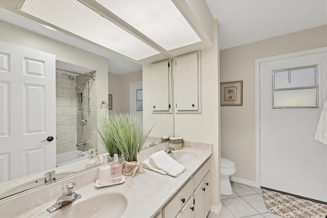 full bath featuring toilet, tile patterned flooring, double vanity, shower / bathtub combination, and baseboards