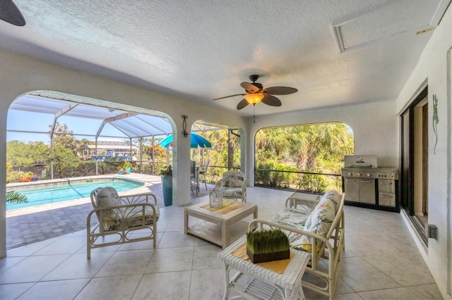 view of patio with ceiling fan, an outdoor pool, a grill, and a lanai