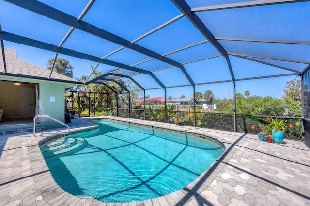 outdoor pool featuring a patio area and a lanai
