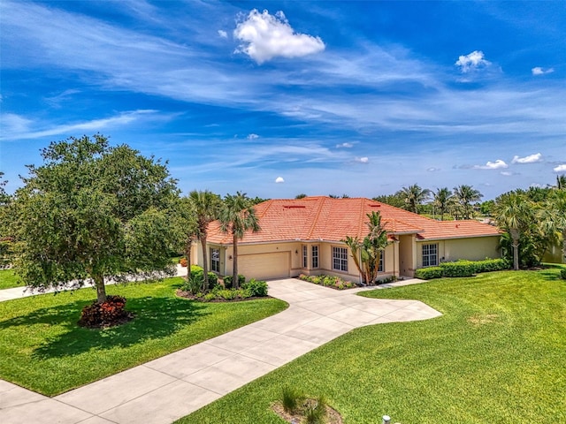 2692 Wax Myrtle Ct, Port Charlotte, FL 33953 - mediterranean / spanish-style house with a garage, a front lawn, concrete driveway, stucco siding, and a tile roof