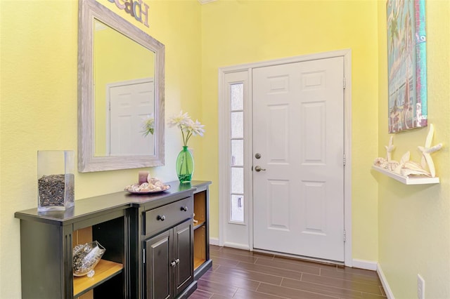 2692 Wax Myrtle Ct, Port Charlotte, FL 33953 - foyer entrance with baseboards, plenty of natural light, and wood finish floors