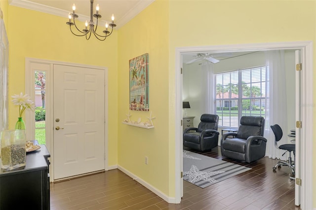 2692 Wax Myrtle Ct, Port Charlotte, FL 33953 - entrance foyer featuring a high ceiling, ornamental molding, a chandelier, wood finished floors, and baseboards