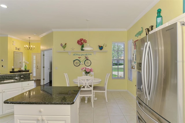 2692 Wax Myrtle Ct, Port Charlotte, FL 33953 - kitchen with stainless steel refrigerator with ice dispenser, light tile patterned flooring, white cabinets, a chandelier, and ornamental molding