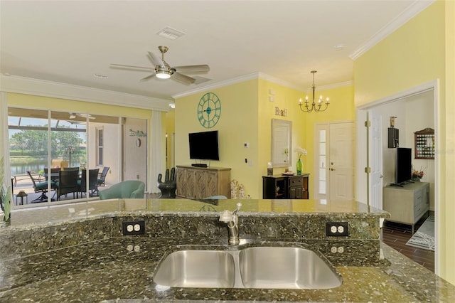 2692 Wax Myrtle Ct, Port Charlotte, FL 33953 - kitchen featuring a sink, a chandelier, ornamental molding, ceiling fan, and dark stone countertops