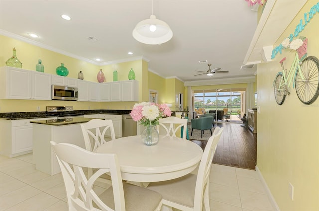 2692 Wax Myrtle Ct, Port Charlotte, FL 33953 - dining room featuring light tile patterned flooring, ornamental molding, ceiling fan, recessed lighting, and baseboards